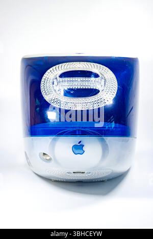 Vintage Apple iMac G3 computer in blue and white with logo visible, rear view isolated  against a plain white studio background Stock Photo