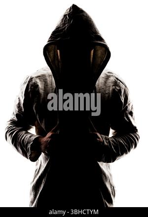 A silhouette of a person wearing a hooded jacket, obscuring their face and identity. The person's hands are positioned near the center of their chest, Stock Photo