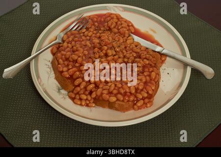Baked beans in tomato sauce served on sourdough toast a great breakfast staple!! Stock Photo