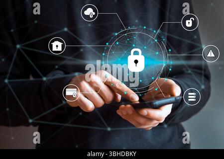 Man holds a phone, drawn icons with padlock, business card added. Stock Photo