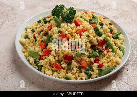 Couscous with vegetables, paprika, carrots, string beans, corn, homemade, top view, no people Stock Photo