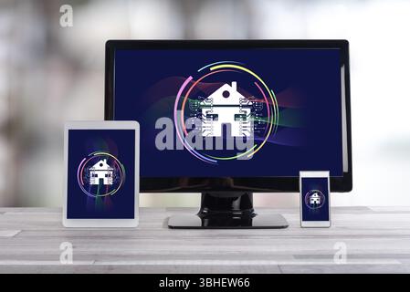 Smart home concept shown on different information technology devices Stock Photo