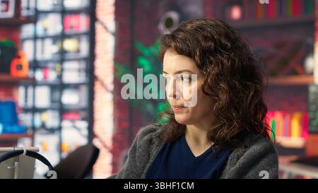 Worker uses AI chatbot system to guide through problem solving tasks, futuristic technology highlights smart algorithms and machine learning. Communication and IT support. Camera B. Stock Photo