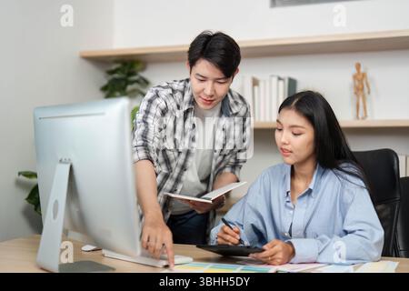UX and UI Design Collaboration. Young professionals discussing digital design concepts at a modern workspace. Stock Photo