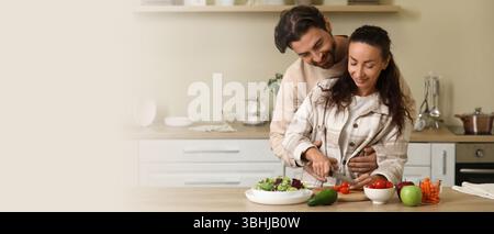 Married couple cooking in kitchen. Banner for design Stock Photo