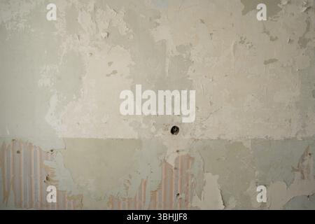 Textured wall with wallpaper in vintage style. Stock Photo