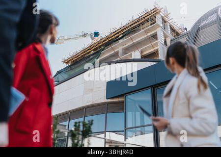 Two female entrepreneurs analyzing a construction project site Stock Photo