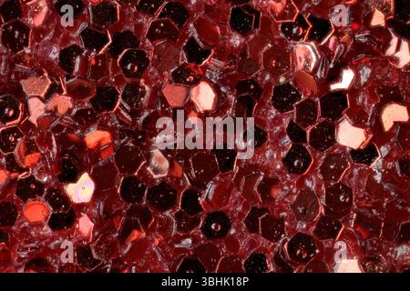 Macro View of Sparkling Red Glitter Hexagons Stock Photo