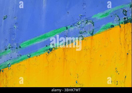 Yellow and blue painted grunge background creating an abstract and colorful texture Stock Photo