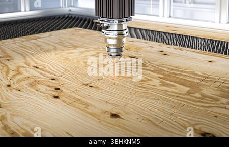 Industrial laser cutter engraving plywood 3d Stock Photo