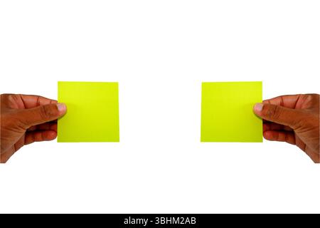 yellow card showing by two hands, sticky notes holding by hands with white background Stock Photo