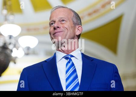 Senate Majority Leader John Thune, R-S.D., talks to reporters outside