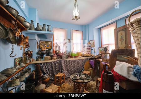 An old kitchen room, filled with old bowls, metal cookware, other food items. At the Namik Kemal House Museum in Tekirdag, Turkey. Stock Photo