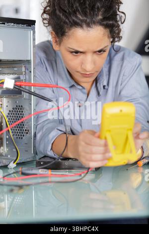 a woman during computer repair Stock Photo