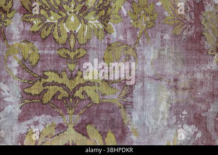 Vintage Floral Fabric Wallpaper with Gold and Purple Damask Pattern Texture Stock Photo