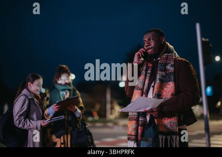 Professionals Collaborating Outdoors During the Evening Stock Photo