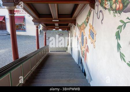 LINDAU, GERMANY - JANUARY 26, 2025: A unique low-angle view looking down a traditional outdoor staircase in Lindau, Germany Stock Photo