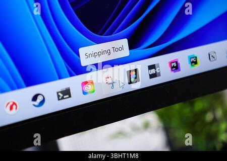 Poznan, Poland - June 6, 2025: A close-up view of a computer screen displaying the Snipping Tool application icon and mouse cursor, highlighting moder Stock Photo