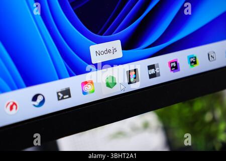 Poznan, Poland - June 6, 2025: Close-up view of Node.js application icon on a Windows 11 taskbar, with a mouse cursor highlighting the software for mo Stock Photo