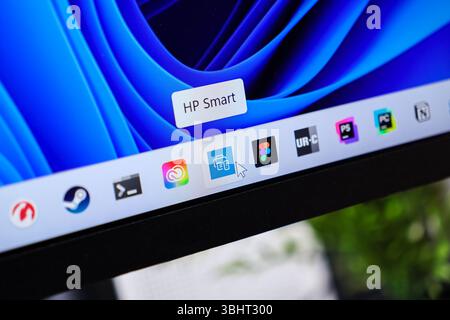 Poznan, Poland - June 6, 2025: Close-up view of the HP Smart application icon on a modern computer taskbar, illustrating digital setup and remote prin Stock Photo