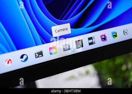 Poznan, Poland - June 6, 2025: Detailed view of a modern digital screen with a mouse cursor indicating the Camera application, embodying intuitive ope Stock Photo
