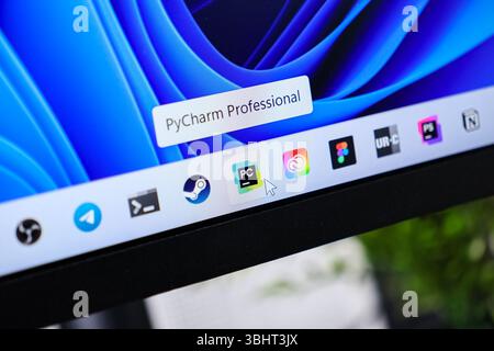 Poznan, Poland - June 6, 2025: PyCharm Professional, a popular Python IDE, is shown on a Windows 11 desktop, with a mouse cursor selecting its icon, i Stock Photo