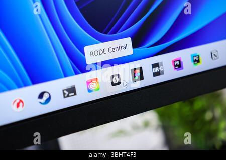 Poznan, Poland - June 6, 2025: Close-up view of RODE Central application highlighted on Windows 11 desktop taskbar, displaying mouse cursor and vibran Stock Photo