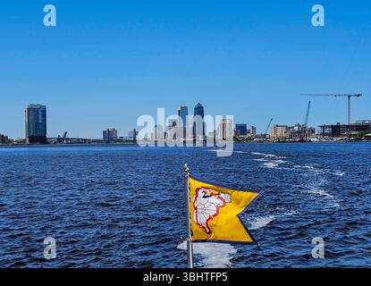 Approaching Jacksonville on the St Johns River, Florida. A pleasure boat flying an AGLCA burgee approaches downtown Jacksonville. Stock Photo