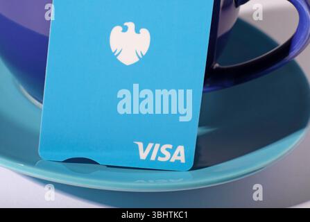 barclays visa debit card on coffee cup and saucer Stock Photo