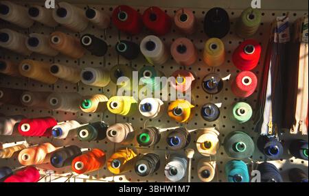 Spools of multi-colored threads in haberdashery in Provence. Stock Photo
