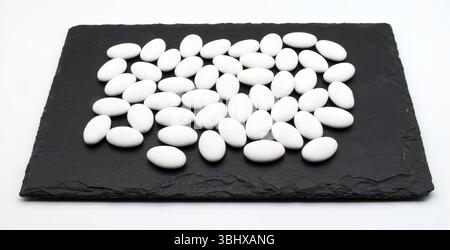 Jordan almonds isolated on black display. Stock Photo