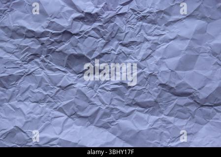 Purple color crumpled paper for background. Stock Photo