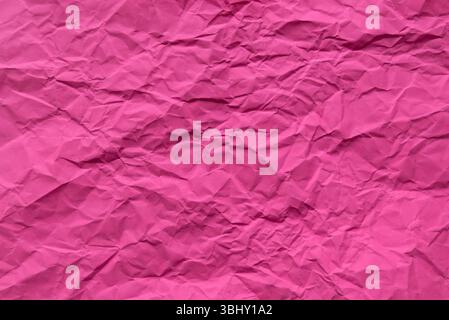 Pink color crumpled paper for background. Stock Photo