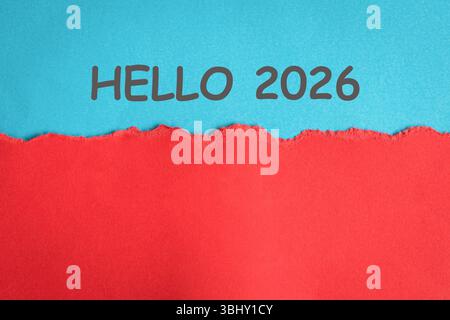 Hello 2026 on blue and red paper surface. Stock Photo