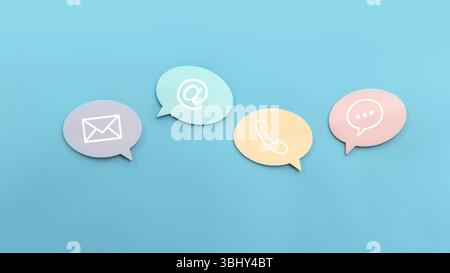 Icon of communication type on colourful speech bubble over a blue background. Contact us or Customer support hotline people connect. Stock Photo