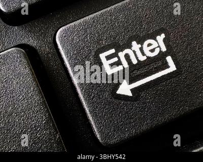 Close up of enter button on computer keyboard. Stock Photo