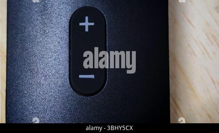 Minimalist Volume Control Button on a Modern Device Stock Photo