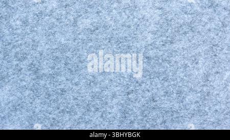 Close-Up View of a Gray Felt Fabric Texture Showing Detailed Fibers Stock Photo