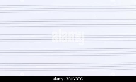sheet of musical notebook in a line for writing notes. Stock Photo