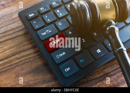 Gavel and Keyboard with Law Key - Legal Technology Concept Stock Photo