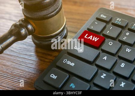 Gavel and Keyboard with Law Key - Legal Technology Concept Stock Photo