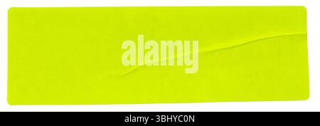 fluorescent neon yellow rectangular paper sticker label isolated on white background. Stock Photo