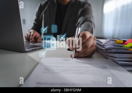 An approved the survey form checklist person signing document desk with digital icons representing checkmarks and files, indicating digital approval Stock Photo