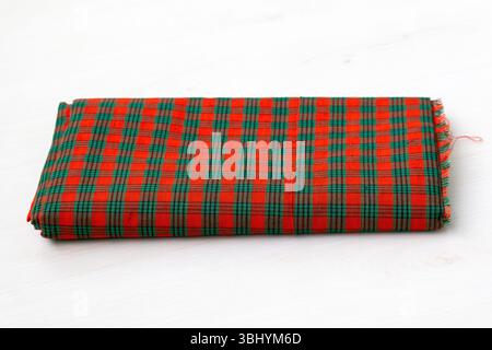 A gamcha (also called gamchha, gamucha, gamusa, gamsa, angocha, or gamocha) is a traditional, thin, colorful, coarse cotton towel fabric used in vario Stock Photo