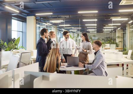 Team Collaborating In Office Meeting With Documents Stock Photo