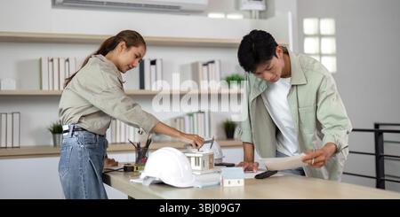 Architects Collaborating on Sustainable Design Projects Stock Photo