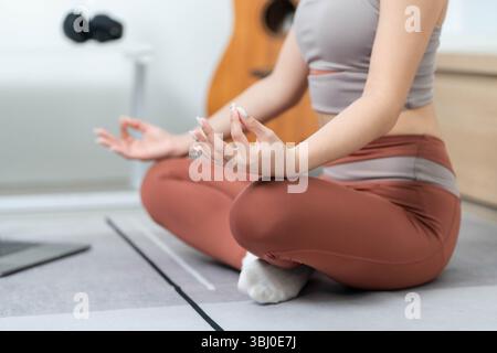 Yoga and Meditation. Woman practicing mindfulness and meditation at home for mental clarity. Stock Photo