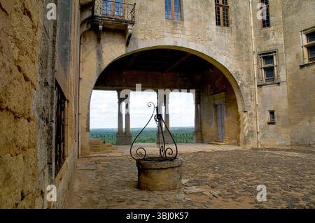 Château de Biron – Historic Monument in Dordogne can be seen sticking out of the horizon for miles through the Lot Et Garonne France Stock Photo