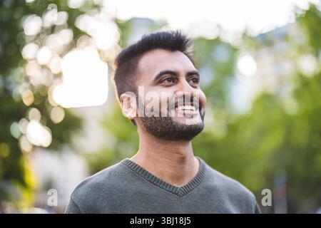 Portrait of a handsome young man with beard in the city Stock Photo
