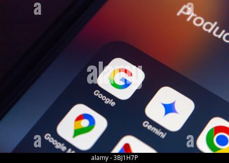 Google app alongside other bundled Google apps such as Gemini, Maps, and Chrome icons, symbolizing the integration of Google ecosystem in everyday use Stock Photo